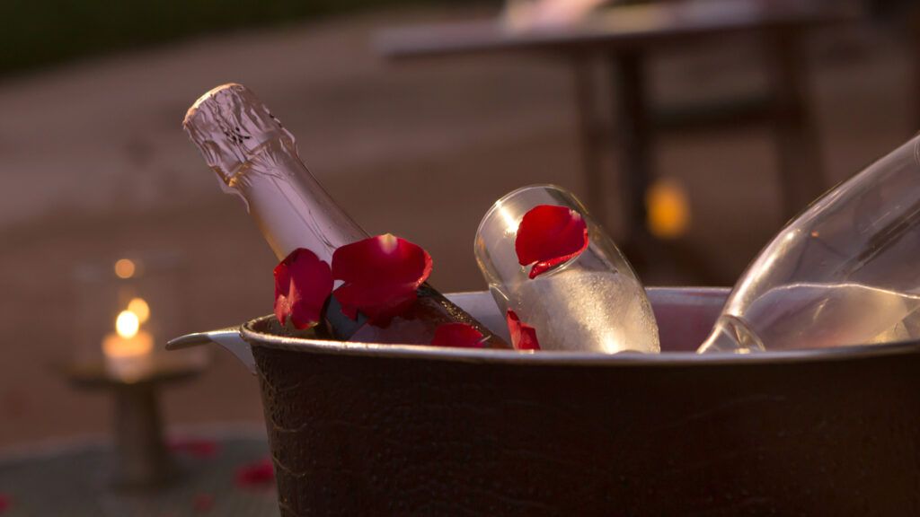 Champagne bucket with rose petal leaves