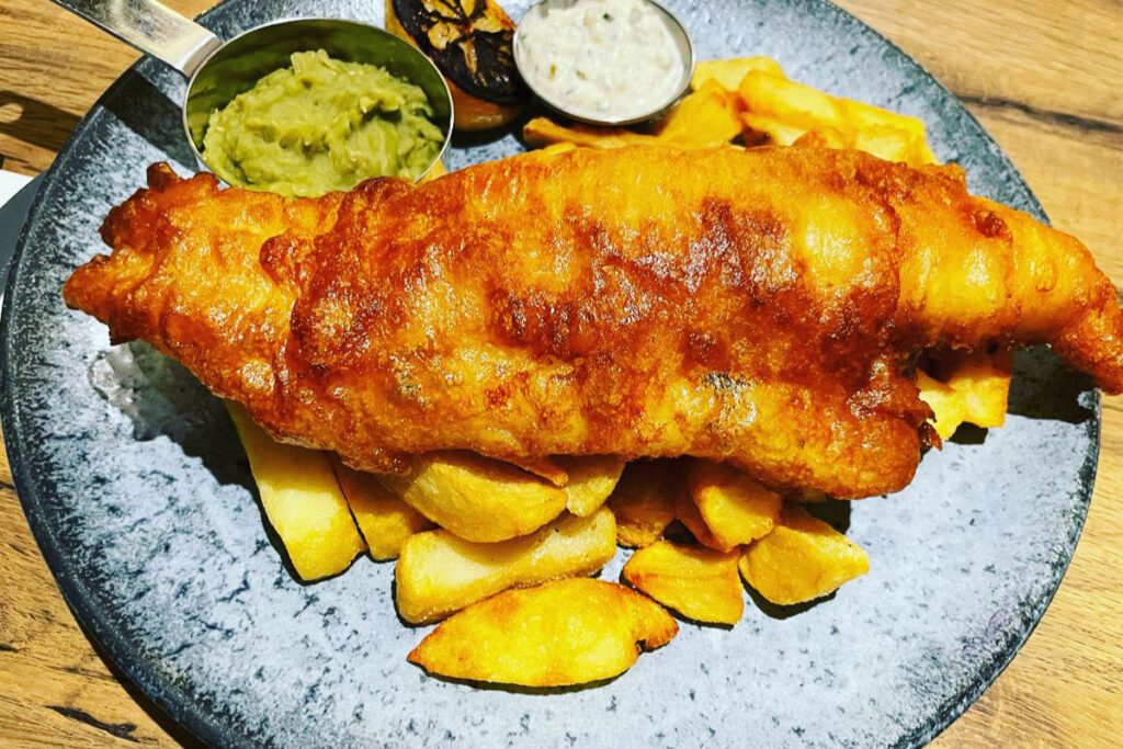 Battered fish and chips with mushy peas and tartare sauce at The Plough