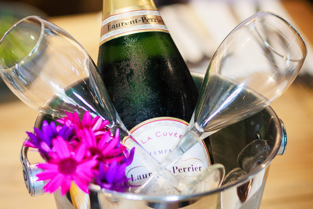 A bottle of champagne on ice with two glasses at The Plough, Lupton